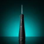 Nuve Water Flosser cordless unit standing upright with 360-degree nozzle